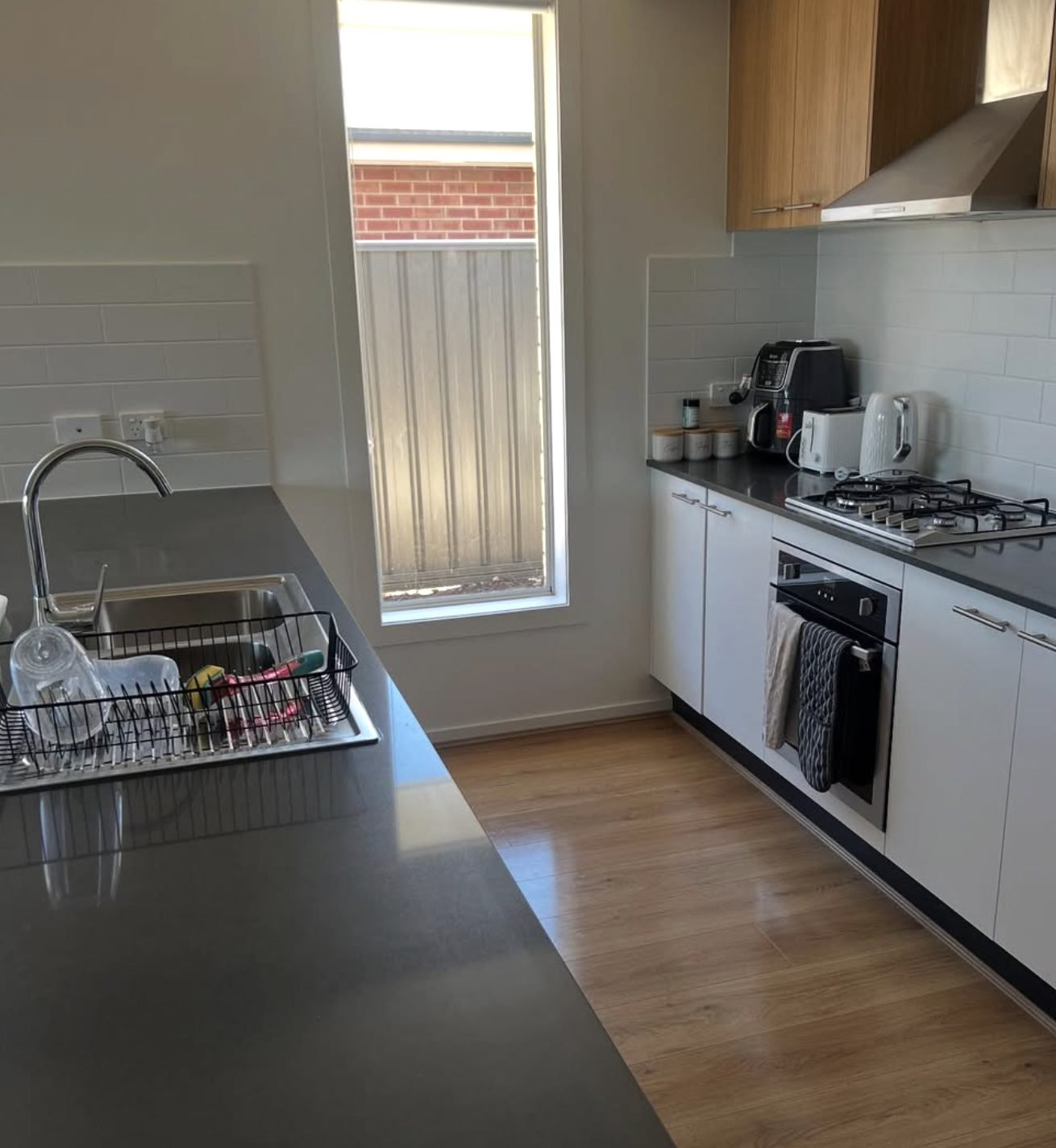 Kitchen worktops, sink and hob cleaned down